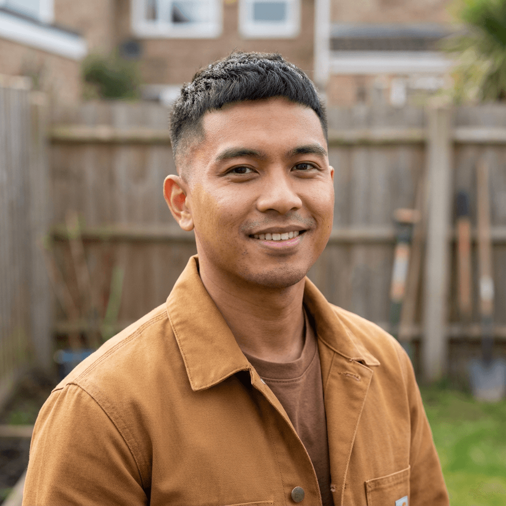 Derek Simmons in a casual shirt in a home workshop